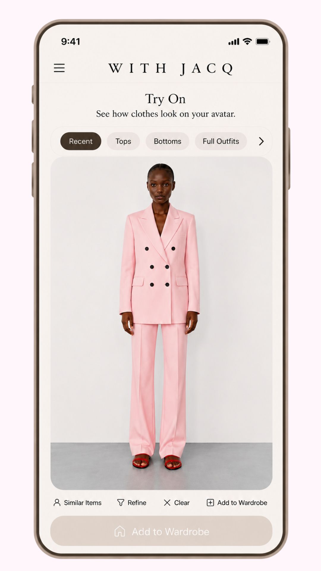 With Jacq AI personal styling app — Try On feature showing a model in a pink tailored suit, demonstrating AI-powered outfit recommendations and virtual try-on for women